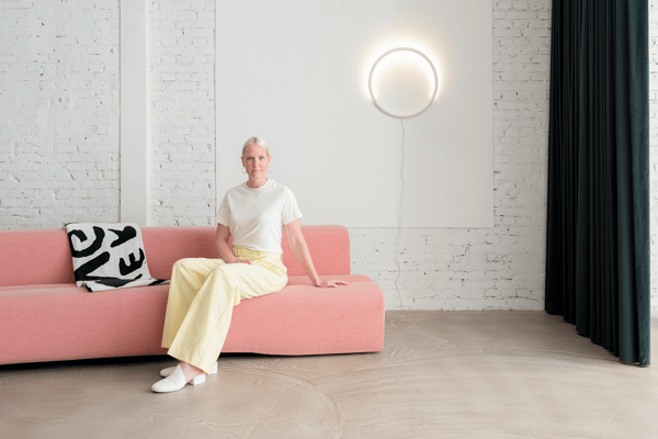 Sabine Marcelis sits beneath circular light for new collection
