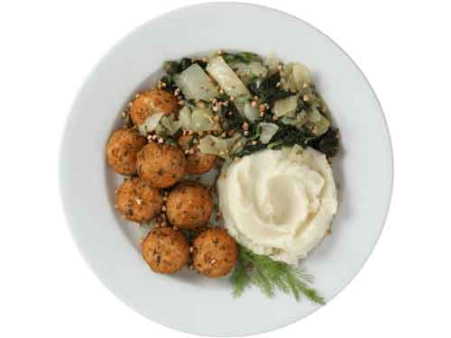 Salmon Balls with sides on white plate and white backround