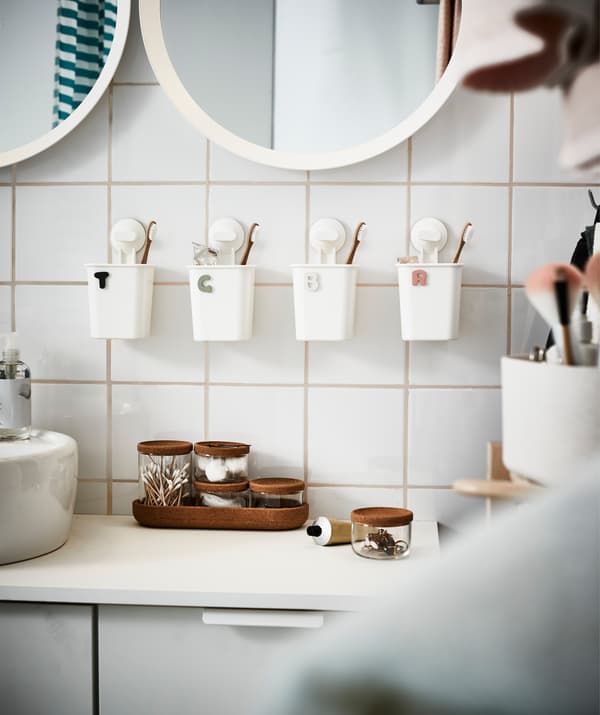 Same procedure here. Individual toothbrush holders avoid both confusion and pleads of ignorance.