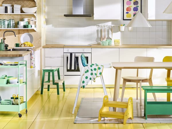 Scandinavian modern kitchen with white ANTILOP highchair, NISSAFORS trolley and LISABO table and chair.