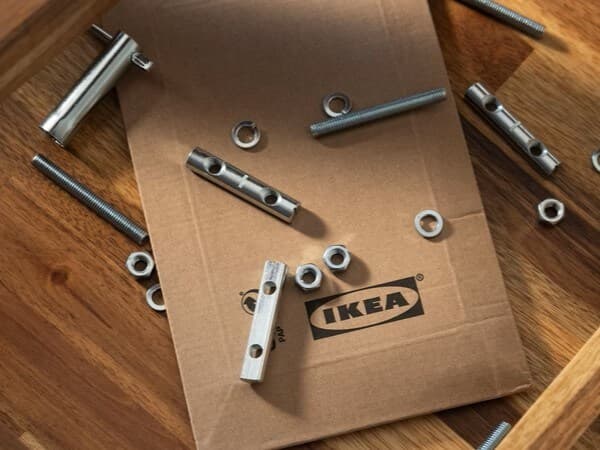 Screws lying on an IKEA table.