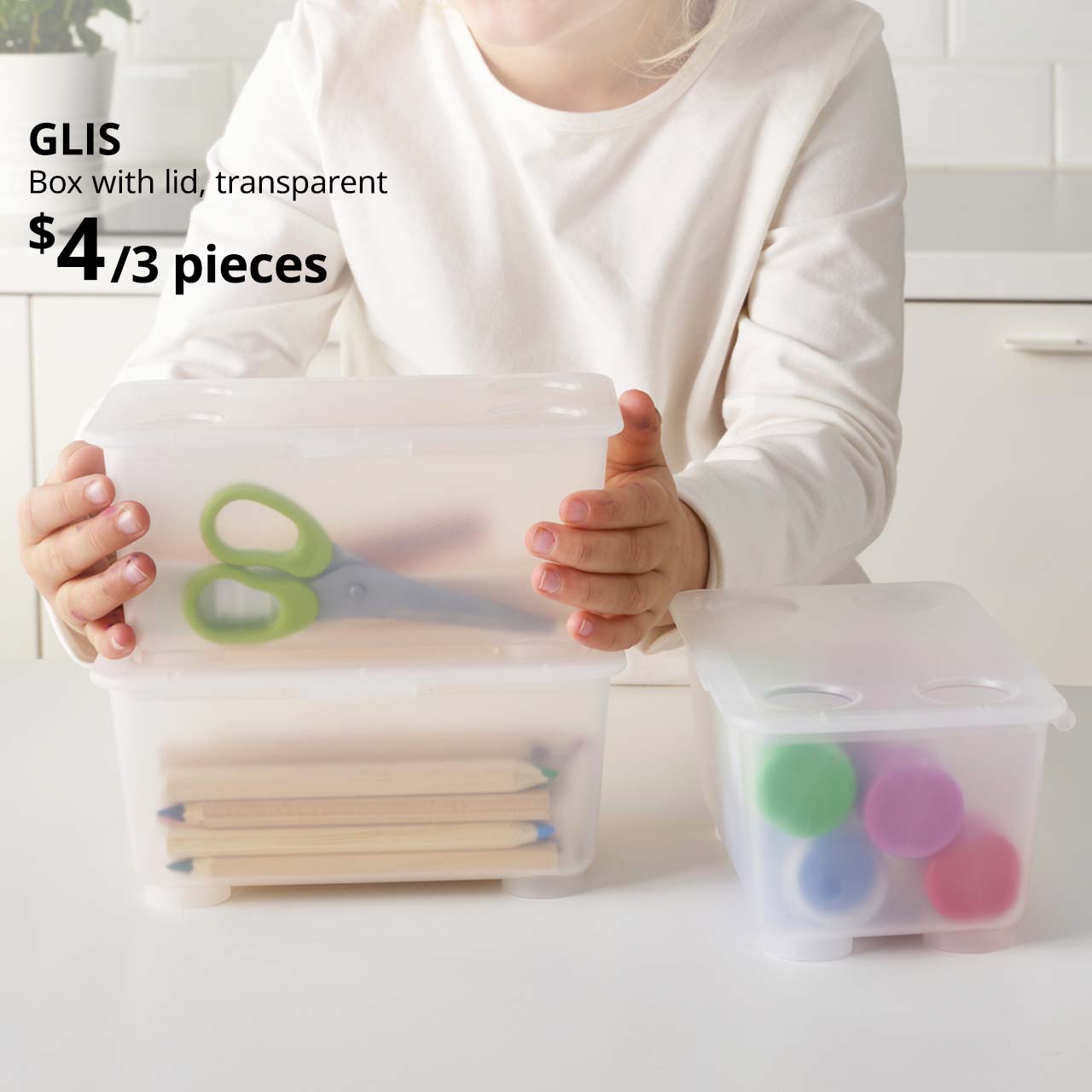 Set of 3 transparent GLIS box with lid, filled with various stationery such as coloured pencils and scissors. $4/3 pieces. 