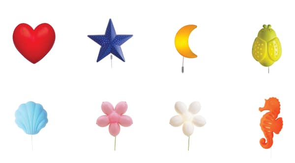 Several wall mounted kids lamps in various shapes and colors against a white background.