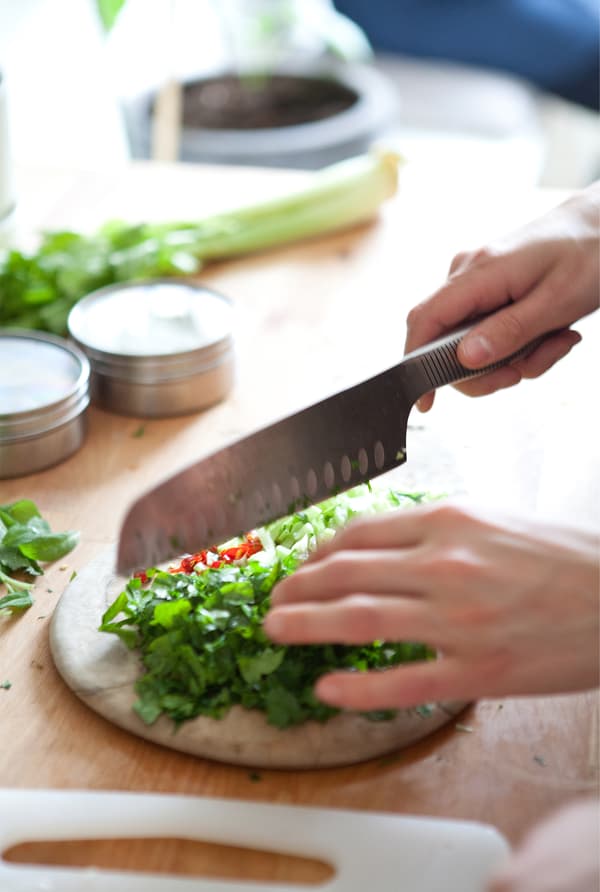 Shalony chops the ingredients.