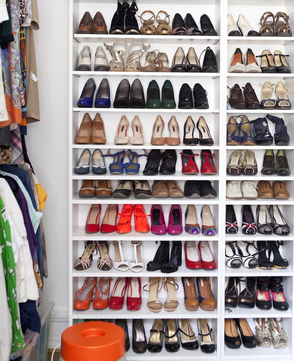 Shoes stored in a bookcase.