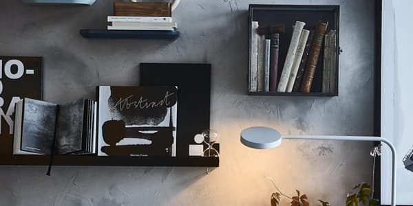 Show off your favourite reads in a book display with BARKHYTTAN plastic and steel display box from IKEA. It spotlights a few books while keeping them away from dust. You can use picture ledges and frames to make a larger gallery wall of written works.