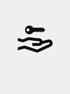 Silueta d’una mà amb una clau.