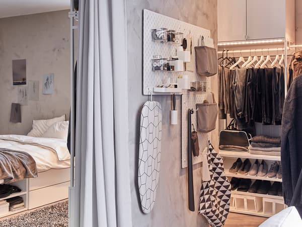 SKÅDIS pegboards and accessories hang on a narrow wall, and they store and organise clothing care items.