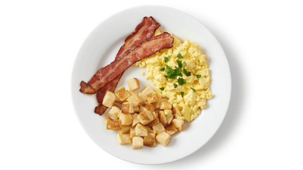 Small breakfast plate with bacon, eggs, and potatoes