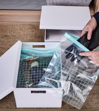 Smaller winter accessories like gloves and scarves are placed and stored in plastic bags. 
