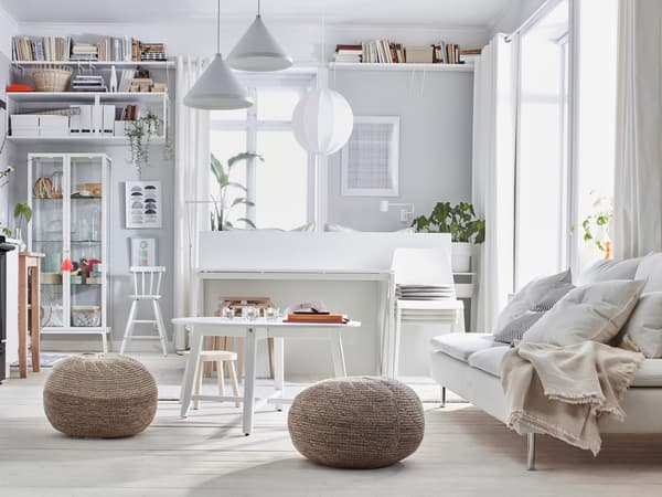 SÖDERHAMN sofa in a bright room with rattan chairs around.