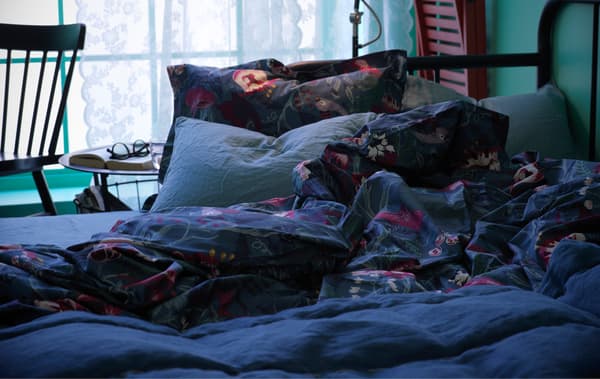 Soft and comfy bed textiles on a bed.