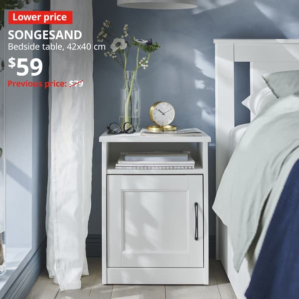 SONGESAND bedside table in white with Lower price tag. Price: $59. Previous price with red slash: $79.