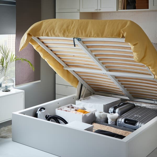 Spacious storage compartment inside the bed with a lifting mechanism.