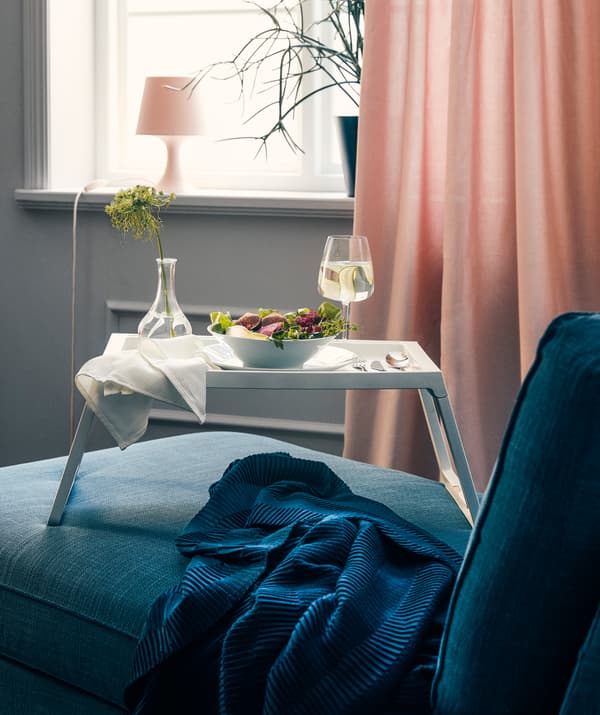 Spoil yourself with a festive movie dinner on an IKEA KLIPSK bed tray once in a while.