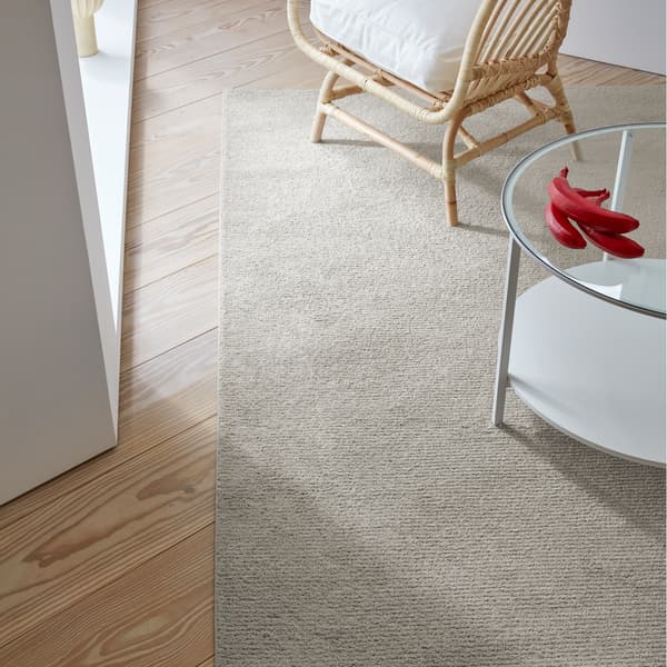 SPORUP rug in a rich beige colour made with a fine yarn that’s densely tufted into a pile that’s incredibly soft.