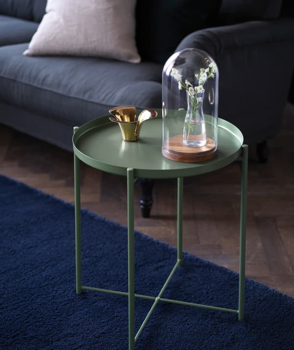 Steel green GLADOM tray table with ornaments.