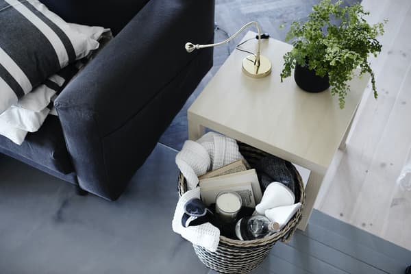 Storage basket under a side table