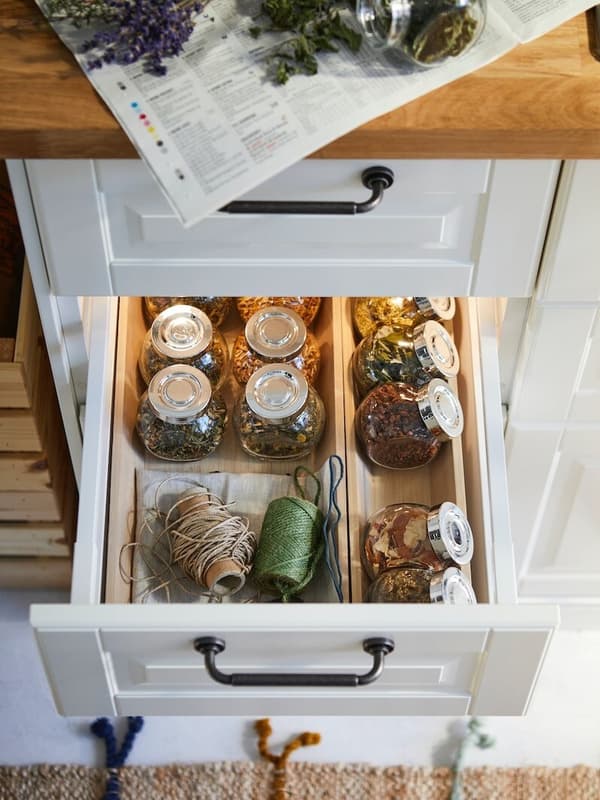Stowed kitchen drawer with white front