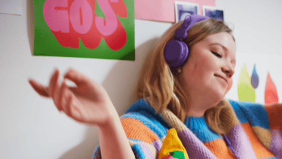 Student listening to their headphones