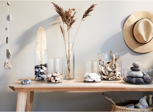 Summer’s keepsakes – pebbles, seashells and all –placed in different-height glass vases form a beautiful display, any time of year.