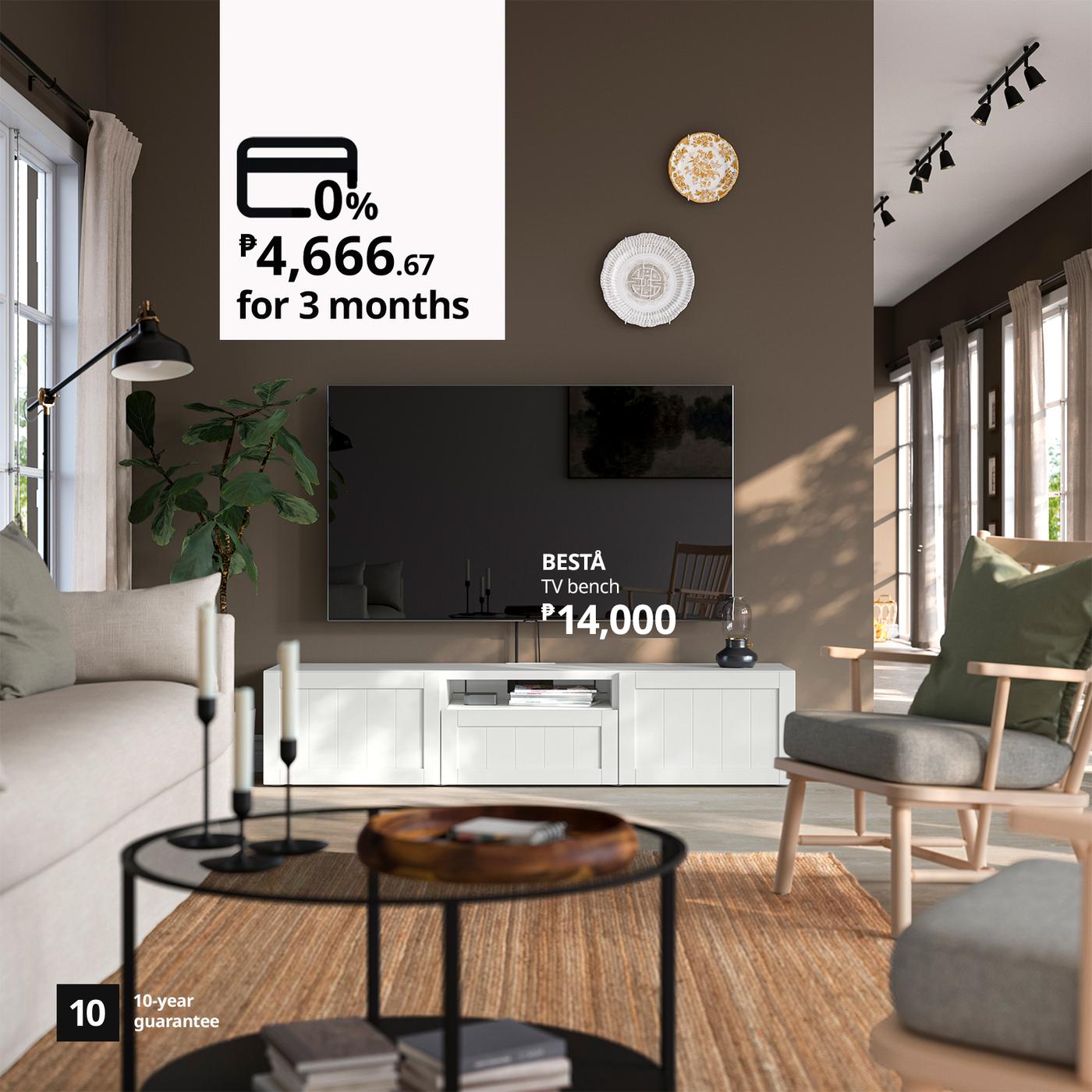 Sunlit neutral living room with a TV and white BESTÅ bench priced at ₱14,000; financing and 10-year guarantee details appear over the scene.