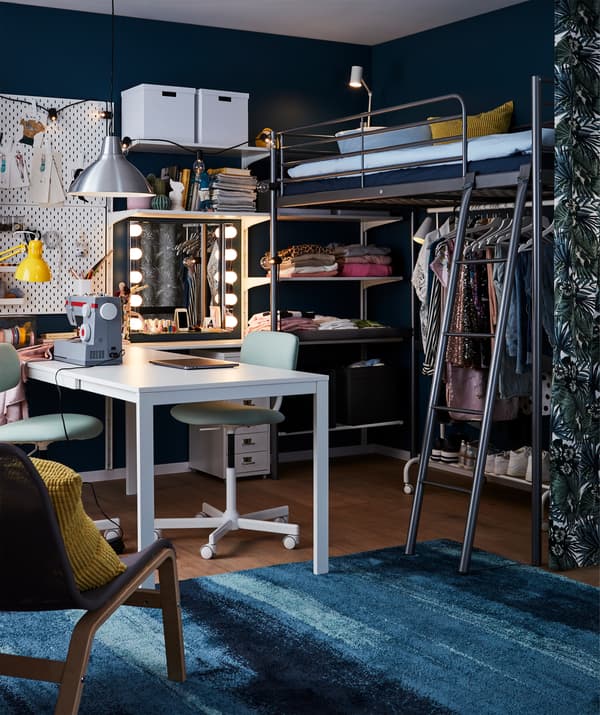 SVÄRTA loft bed frame in silver-coloured steel with a ladder frees up floor space.