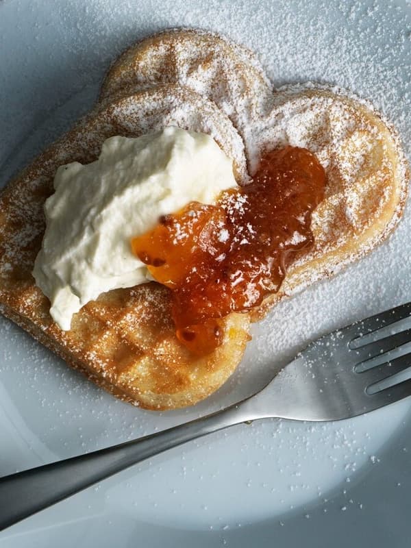 Sweet waffles with clouderry jam and whipped sour cream