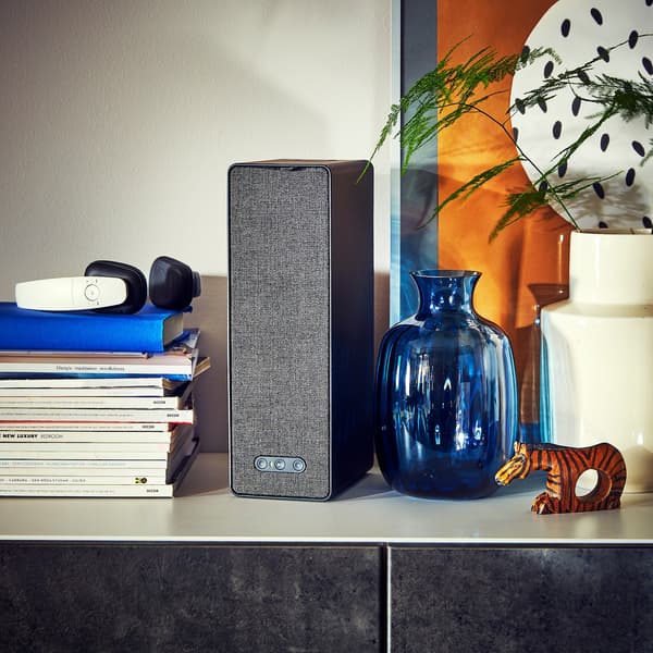 SYMFONISK lamp with WiFi speaker alongside decorative accessories on a dining room cabinet.