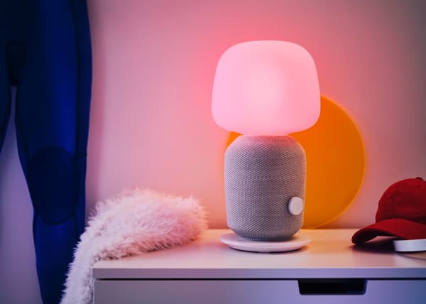 SYMFONISK table lamp speaker in white and grey shown against a white background.