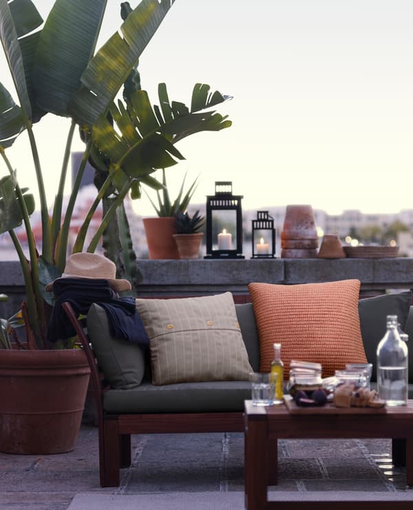Terrace with chill out decor and natural plants
