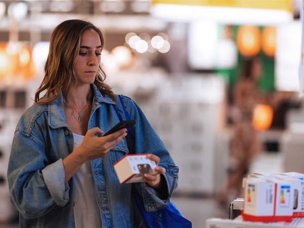 The customer scans the product in the store using the IKEA app.