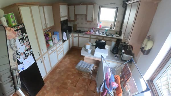 The family used the kitchen the most, but with no dining table and little seating 