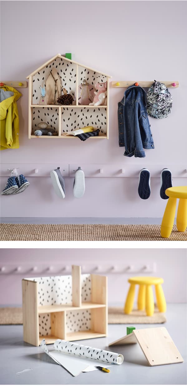 The IKEA FLISAT doll’s house used for storage in a hallway