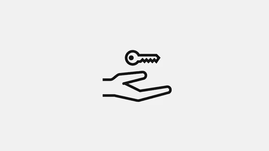 The logo of rental services with a key hanging above the hand