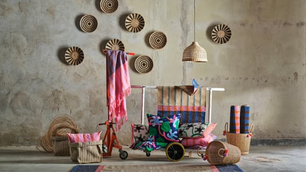 The MÄVINN collection featuring a weaving station with hanging lights, wall decor and various handwoven materials.