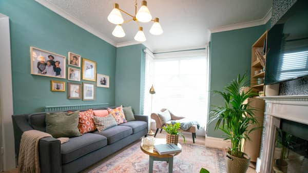 The open plan space is zoned transformed into a bright, light and functional space with a beautiful layered neutral palette of coral, rust, blue and wood, making the space comfortable and more inviting