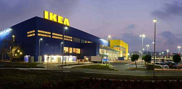 The outside view of an IKEA furniture store in the evening.