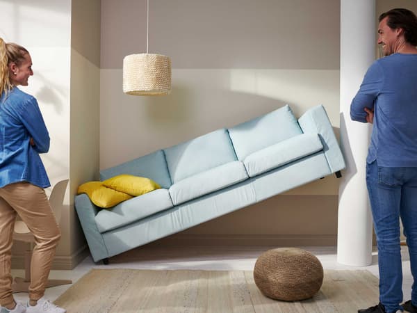 The sofa in the picture does not fit in the space it was intended for, but is stuck against the wall.