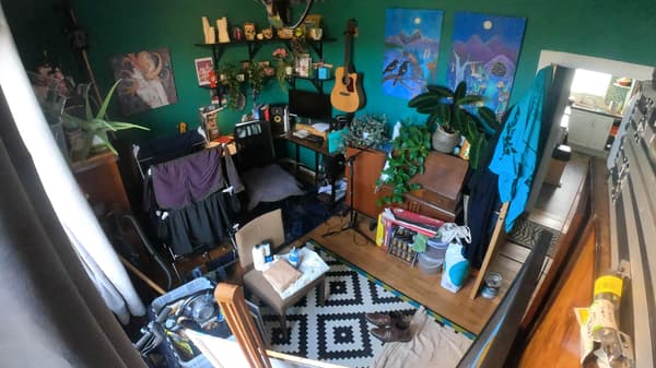 The spare room was converted into a studio with paint and musical instruments not organised