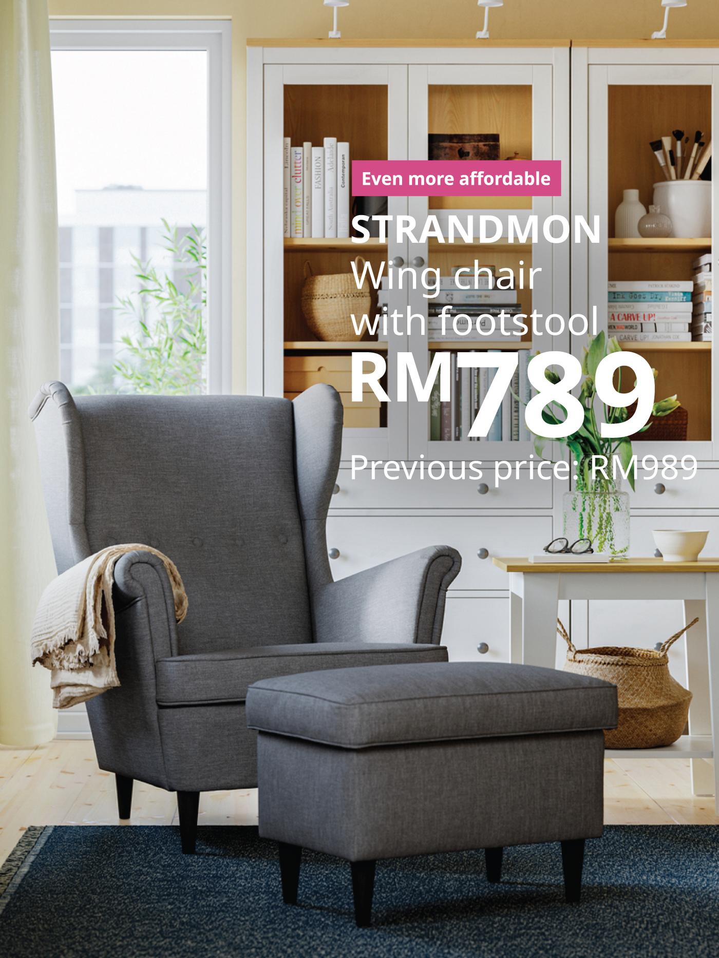 The visual shows a grey STRANDMON wing chair with footstool in a bright living room with shelving in the background. The text reads: “Even more affordable. STRANDMON wing chair with footstool, RM789. Previous price: RM989.”