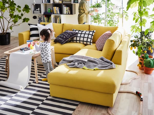 The yellow IKEA VIMLE three seat sofa brings lots of comfort and a little sunshine into your living room.