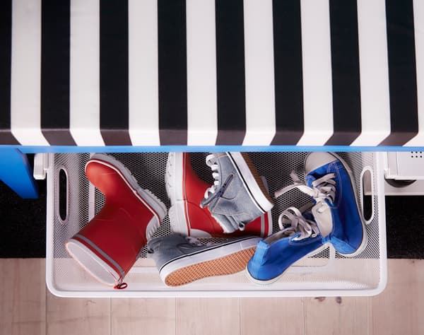 These baskets roll out from undernath a bench for shoe storage.