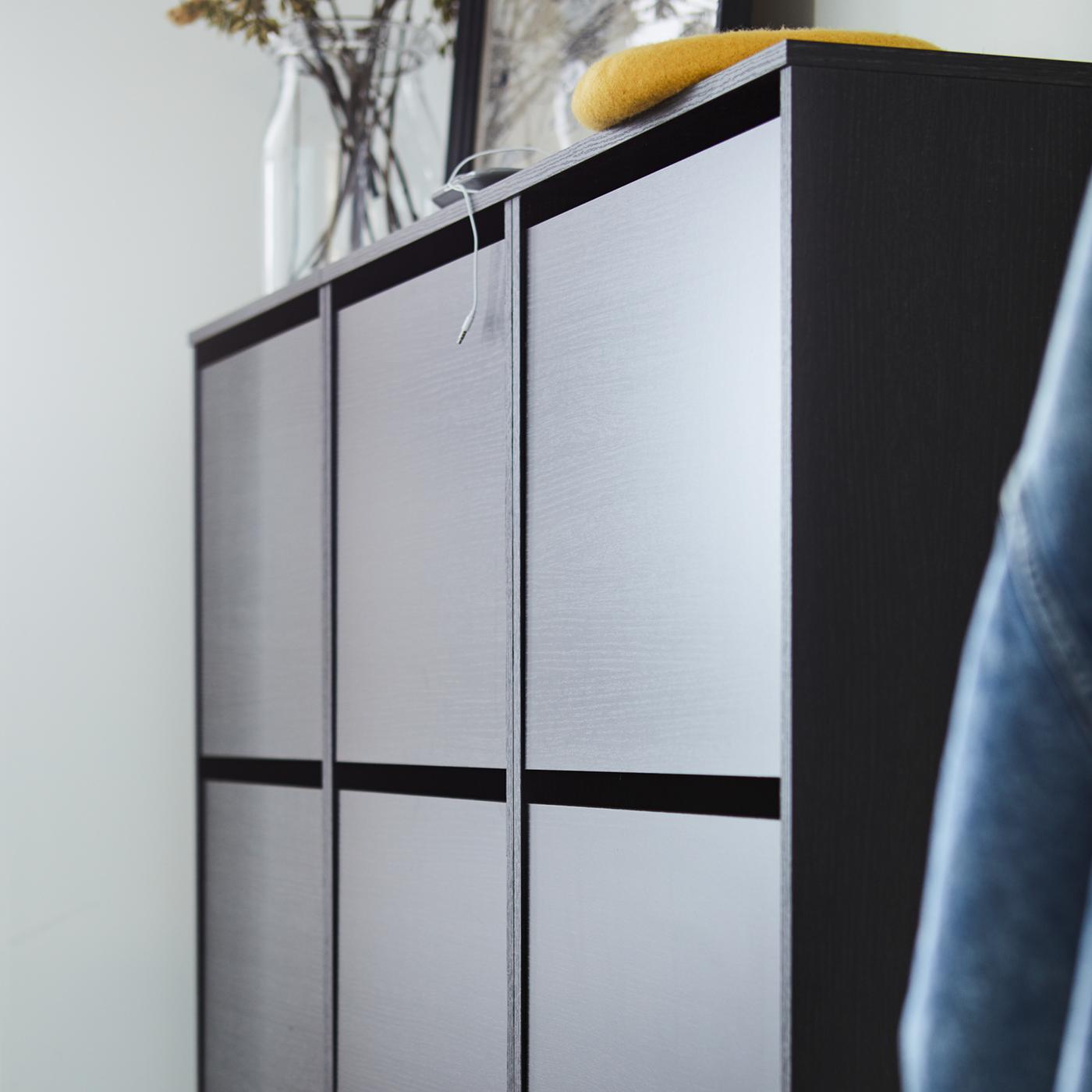 Three black/brown BISSA shoe cabinets with three compartments are mounted to the wall in a hallway.
