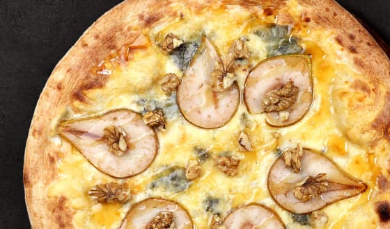 Three Cheese Pizza topped with Tilsit, Dutch and blue cheeses, sliced pears, walnuts and maple syrup.