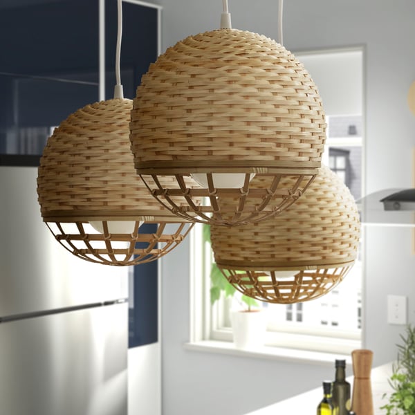 Three IKEA INDUSTRIELL round woven pendant lamps.