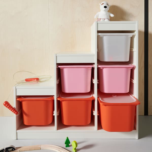 Three larger orange TROFAST boxes and three smaller white TROFAST boxes are slotted into a TROFAST frame.