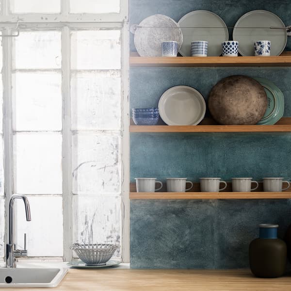 Three MÅLERÅS picture ledges used in a kitchen to display cups and plates, against a blue-green textured wall.