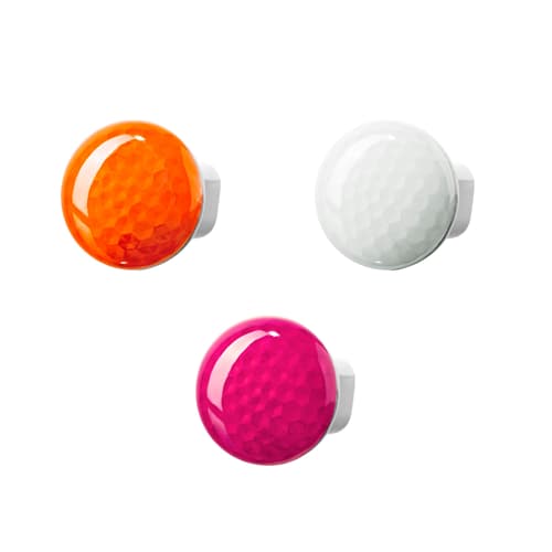 Three nightlights in orange, pink and white against a white background.
