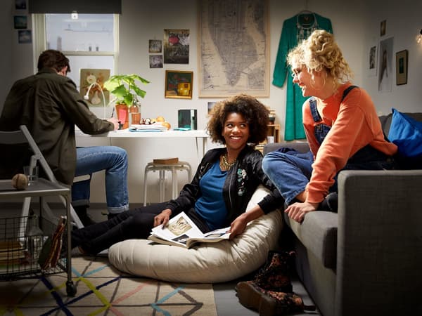 Three people in a small room